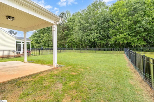 view of yard with a fenced backyard and a patio