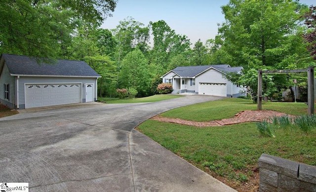 ranch-style house with a front lawn and driveway