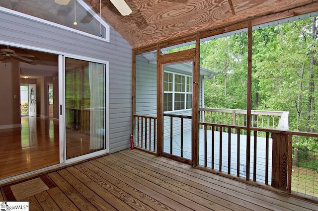 unfurnished sunroom with a ceiling fan