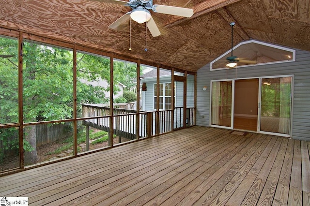 unfurnished sunroom featuring a ceiling fan