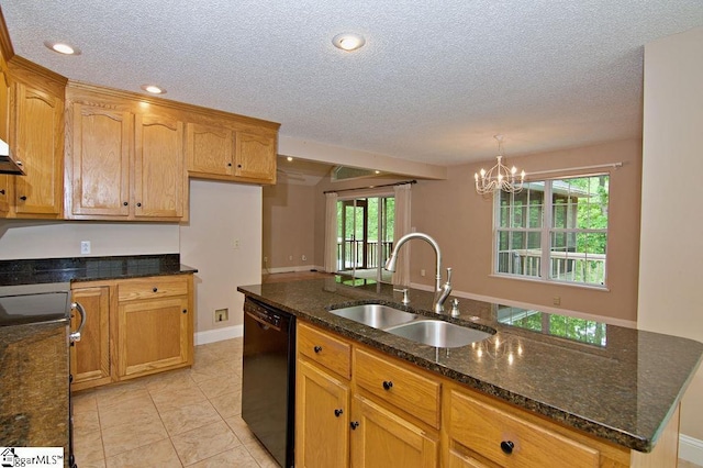 kitchen featuring a sink, dark stone countertops, a textured ceiling, and dishwasher