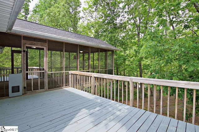 wooden terrace featuring a sunroom