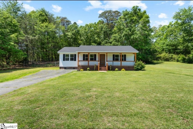 view of front of home with a porch, crawl space, fence, and a front yard