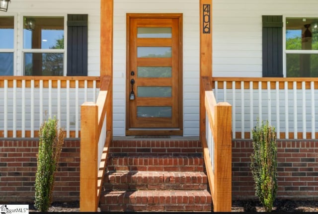 property entrance with a porch
