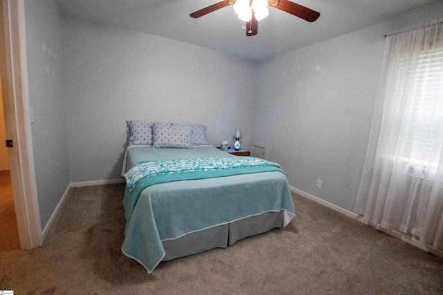 bedroom with carpet floors, baseboards, and ceiling fan