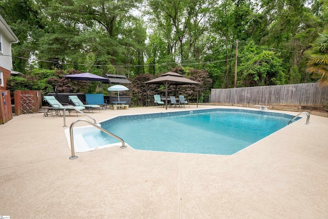 view of pool with a fenced in pool, a patio, a fenced backyard, and outdoor dining space