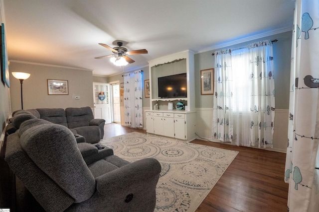 living room featuring crown molding, ceiling fan, and a wealth of natural light