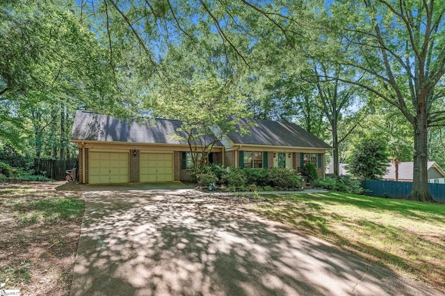2 Finley Ct, Mauldin, SC 29662 - view of front of home with fence, an attached garage, concrete driveway, and brick siding