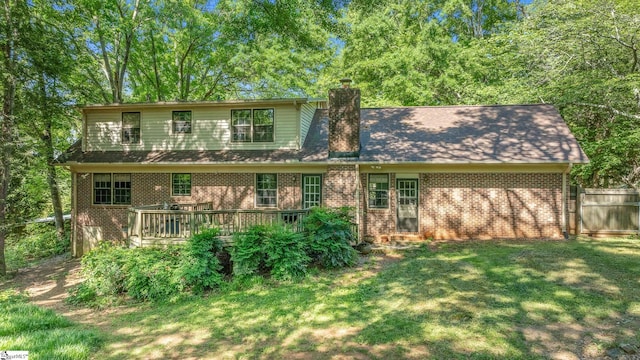 2 Finley Ct, Mauldin, SC 29662 - rear view of property featuring a yard, brick siding, a chimney, and a wooden deck