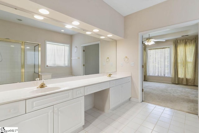 bathroom with double vanity, a sink, recessed lighting, and a shower stall