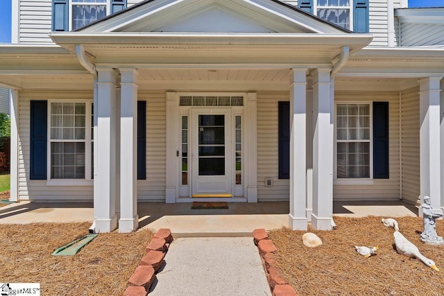 property entrance with covered porch