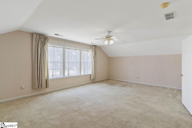 bonus room with visible vents, ceiling fan, and vaulted ceiling