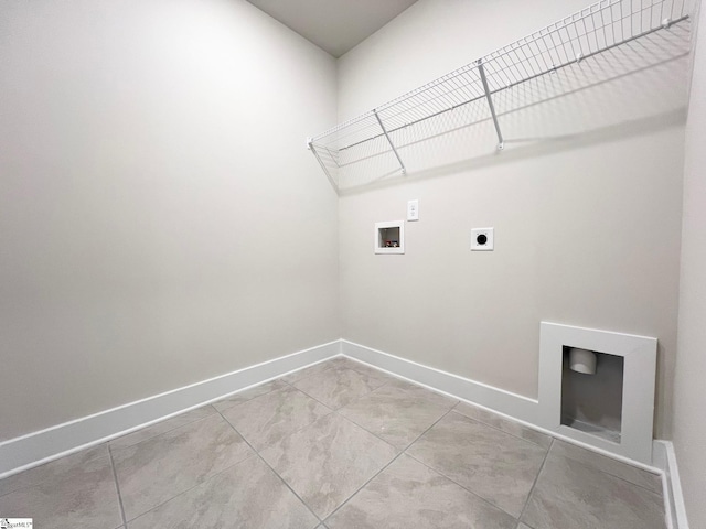 washroom with laundry area, hookup for a washing machine, baseboards, and hookup for an electric dryer
