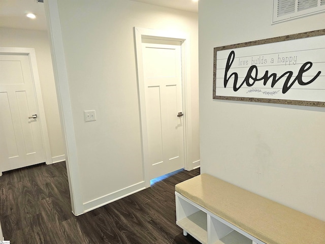 mudroom with dark wood-type flooring, recessed lighting, and baseboards