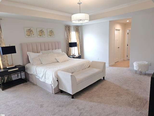 carpeted bedroom featuring baseboards and ornamental molding