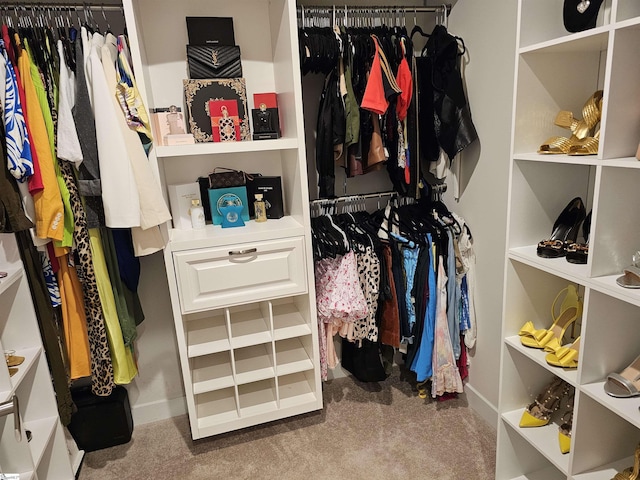 walk in closet featuring carpet