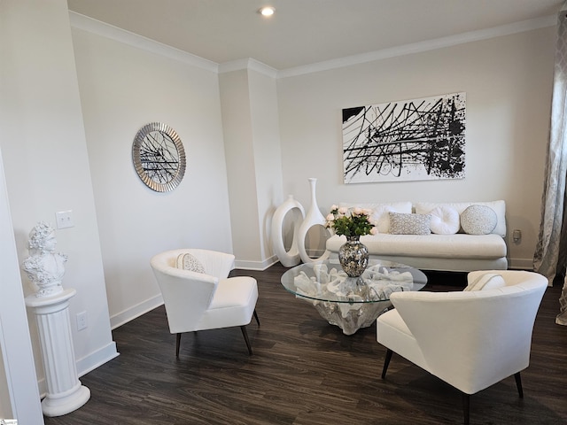 living area with baseboards, crown molding, and wood finished floors