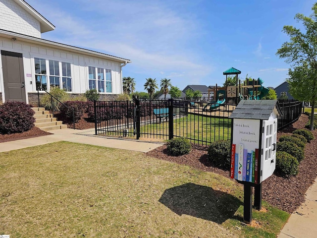 surrounding community featuring fence, a lawn, and playground community