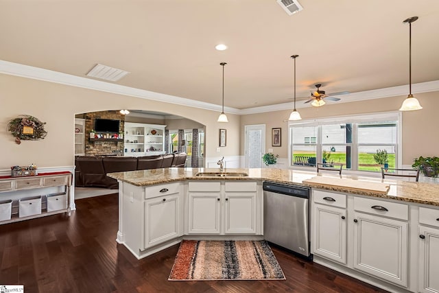 kitchen with a ceiling fan, crown molding, stainless steel dishwasher, a sink, and open floor plan