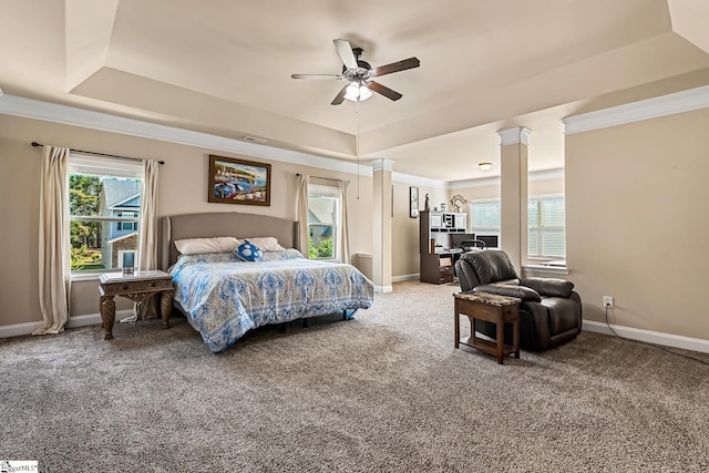bedroom featuring crown molding, carpet floors, a ceiling fan, baseboards, and a tray ceiling