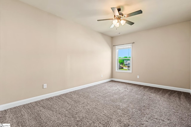 unfurnished room featuring baseboards, a ceiling fan, and carpet floors