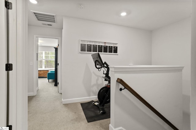 exercise room with carpet floors, recessed lighting, baseboards, and visible vents