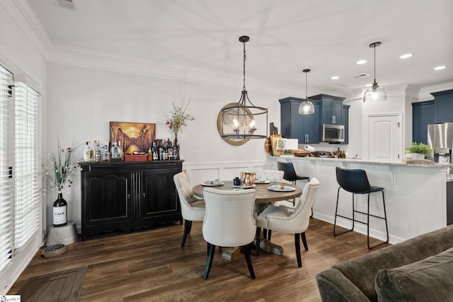 dining area featuring visible vents, ornamental molding, recessed lighting, dark wood finished floors, and a notable chandelier