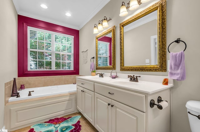 full bathroom featuring crown molding, double vanity, toilet, a bath, and a sink