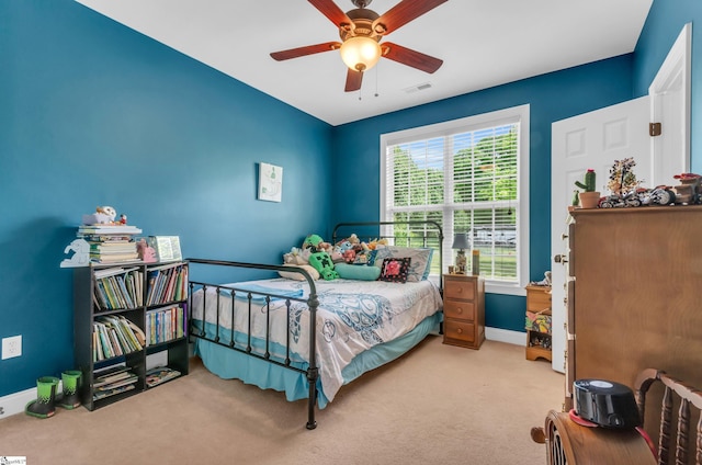 bedroom with carpet floors, a ceiling fan, baseboards, and visible vents