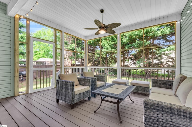 sunroom with an outdoor hangout area, ceiling fan, and a healthy amount of sunlight