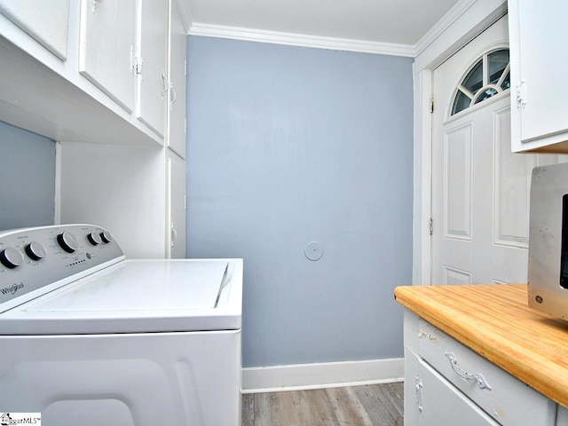 215 Louisiana St, Honea Path, SC 29654 - clothes washing area featuring cabinet space, baseboards, washer / dryer, wood finished floors, and ornamental molding