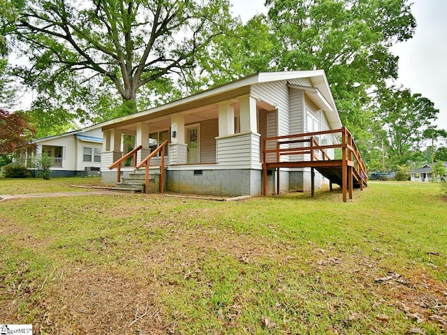 215 Louisiana St, Honea Path, SC 29654 - view of front facade with central AC unit, a porch, crawl space, and a front yard