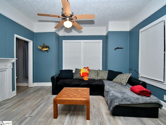 215 Louisiana St, Honea Path, SC 29654 - living area with baseboards, a ceiling fan, and light wood finished floors