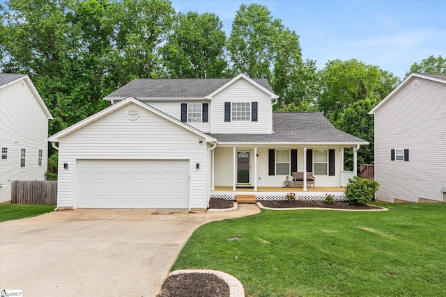 traditional-style house featuring fence, a garage, a front yard, covered porch, and driveway