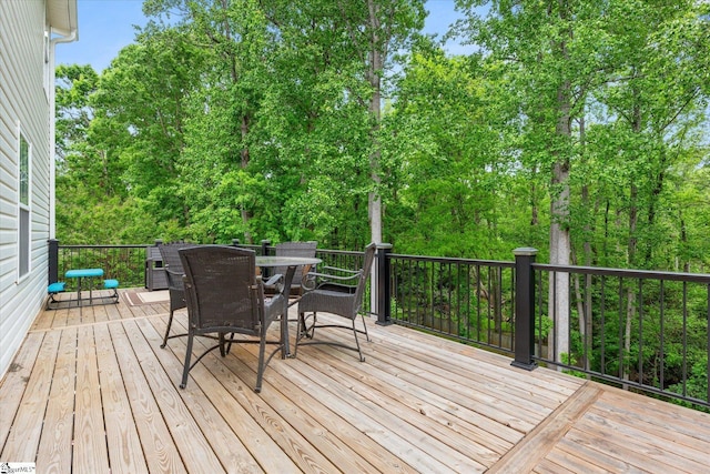 wooden deck with outdoor dining area
