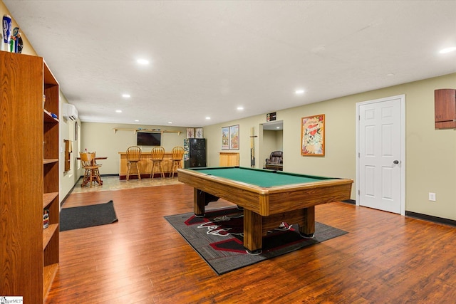 recreation room with recessed lighting, baseboards, billiards, wood finished floors, and bar area