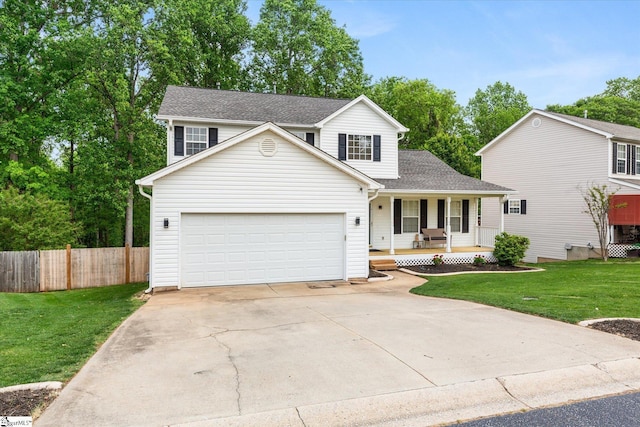 traditional home featuring a porch, a front yard, a garage, fence, and concrete driveway