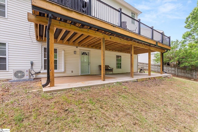 back of house featuring a wooden deck, fence, a patio area, ac unit, and a yard