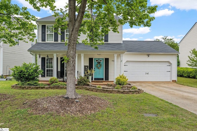 traditional home featuring covered porch, an attached garage, driveway, and a front lawn
