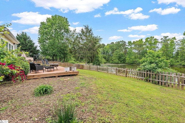 view of yard with a fenced backyard and a deck
