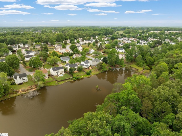 drone / aerial view featuring a water view and a residential view