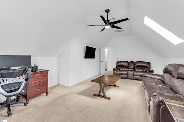 living area with visible vents, light carpet, baseboards, lofted ceiling with skylight, and ceiling fan