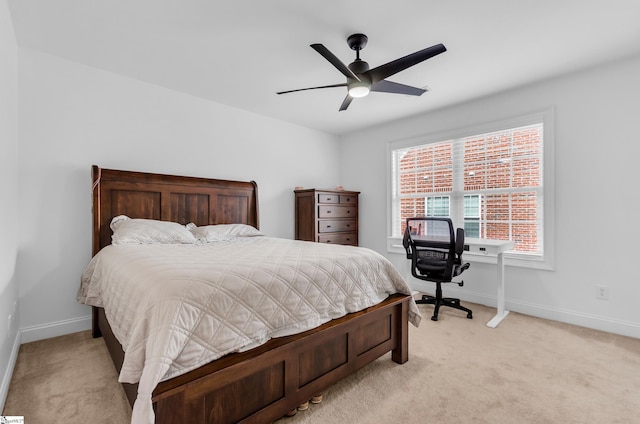 bedroom with baseboards, light carpet, and a ceiling fan