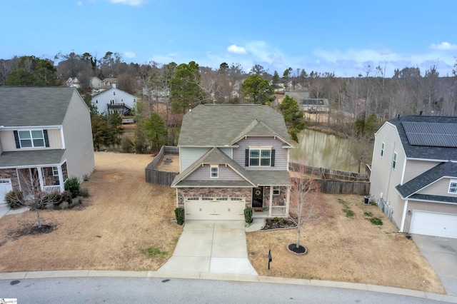 131 Riverdale Rd, Simpsonville, SC 29680 - view of front of property with a residential view, an attached garage, stone siding, a porch, and driveway