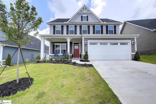 38 Comanche Trl, Greenville, SC 29607 - view of front of home with board and batten siding, a front yard, covered porch, and driveway