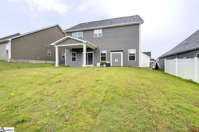 38 Comanche Trl, Greenville, SC 29607 - back of property with a lawn, fence, and central air condition unit