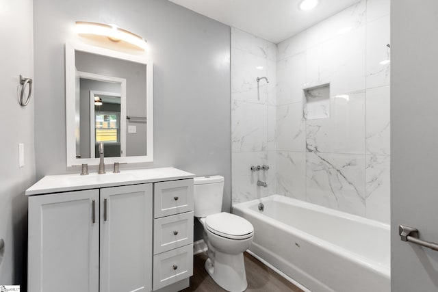 full bathroom featuring vanity, bathtub / shower combination, toilet, and wood finished floors