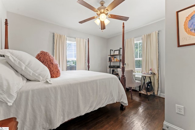bedroom featuring baseboards, ceiling fan, and dark wood-type flooring