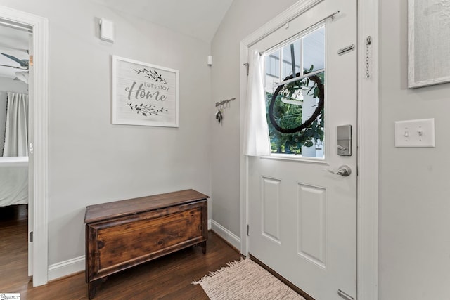 entryway with baseboards and dark wood-style floors