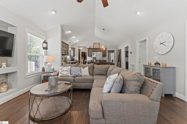 living area with baseboards, ceiling fan, dark wood-style flooring, and lofted ceiling